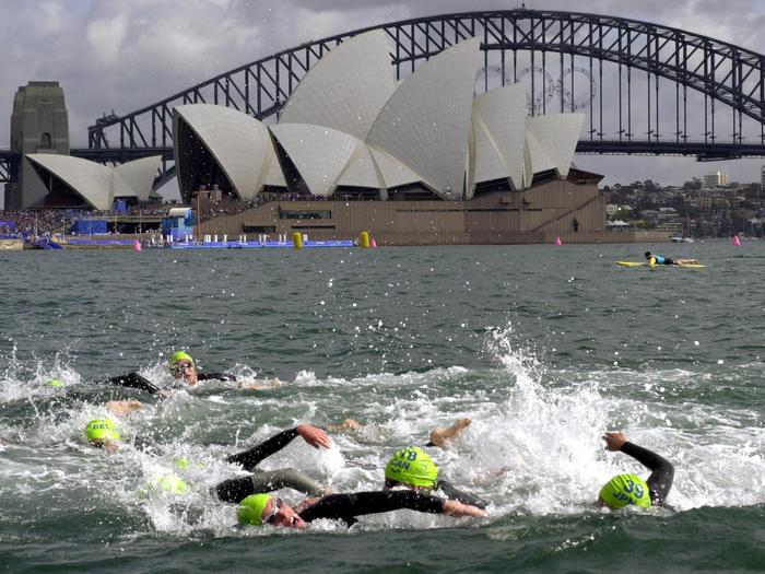 Athletes+swim+past+the+Sydney+Opera+House+during+the+first+leg+of+the+womens+triathlon+at+the+2000+Summer+Olympic+Games+in+Sydney%2C+Saturday%2C+Sept.+16%2C+2000.+%28AP+Photo%2FRobert+F.+Bukaty%29